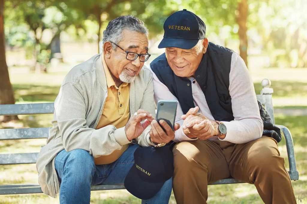 Two retired veterans in Boise reviewing military retirement benefits with financial advisor