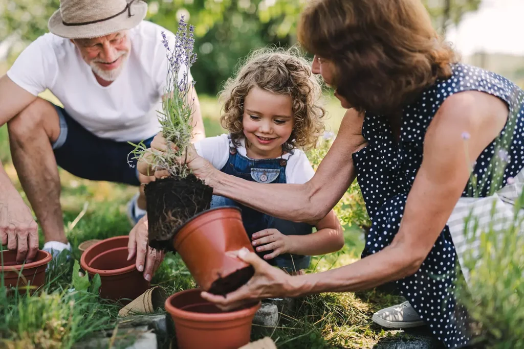 Grandmother and granddaughter gardening together in Boise, ID during retirement